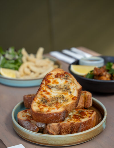 CHEESY GARLIC BREAD (3) 10 sourdough, herbed butter, mozzarella (v)