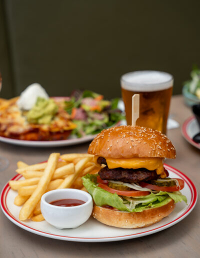 CHEESEBURGER 27 beef pattie, lettuce, tomato, pickles, double cheese, mustard mayo, tomato sauce, steak fries add bacon or egg +4 add extra pattie +7