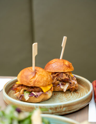 SMOKEY CHIPOTLE PULLED PORK SLIDERS (2) 16 melted cheddar, pickled red onion, hot honey, brioche bun