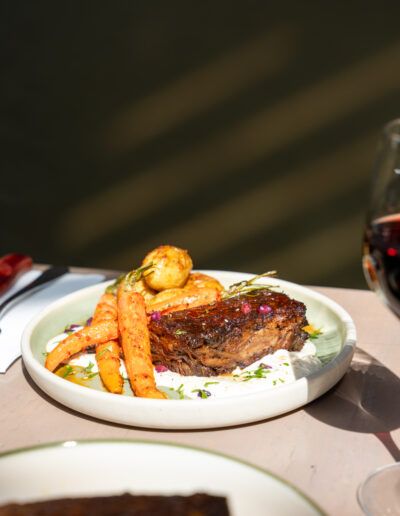 LAMB SHOULDER PRESS 39 harissa glazed baby carrots & chat potatoes, tahini & mint yoghurt, pomegranate, dukkah (lgo, ldo, n)