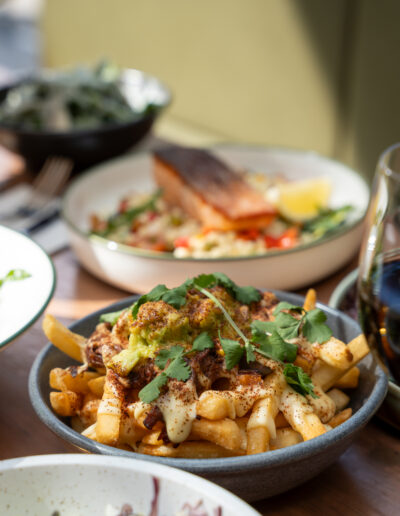 MEXICAN LOADED FRIES 22 brisket, corn, cheese sauce, avocado, jalapeños, coriander (lgo)