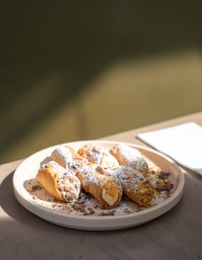 RICOTTA CANNOLI (6) 15 sweet ricotta, candied orange, dark chocolate chips, crushed pistachios (v, n)